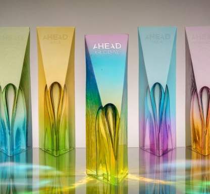 Glass trophies featuring a spectrum of colors by Preciosa Lighting.