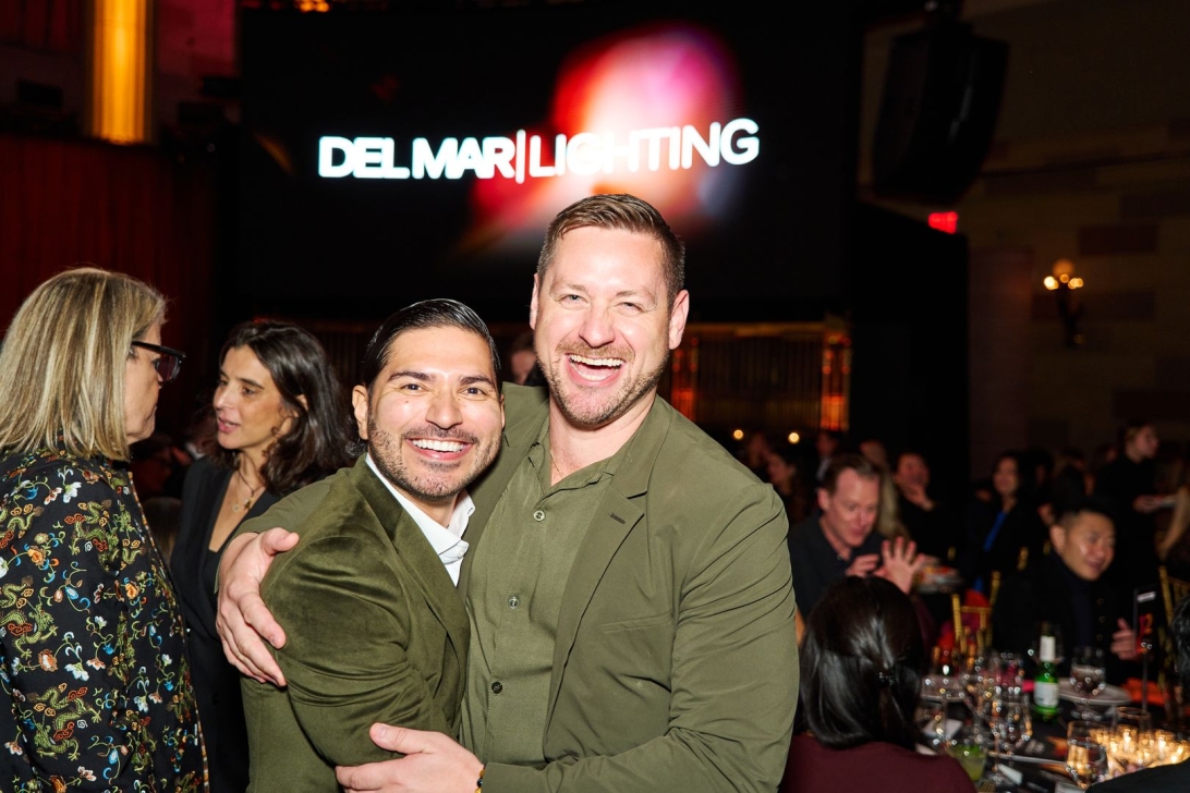 Joyful gathering of attendees at the AHEAD Americas event celebrating hospitality.