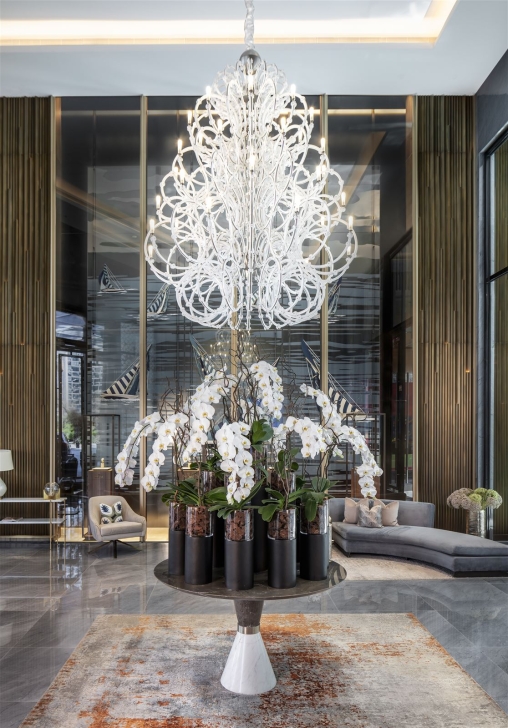 Venus lighting with white orchids and sofas
