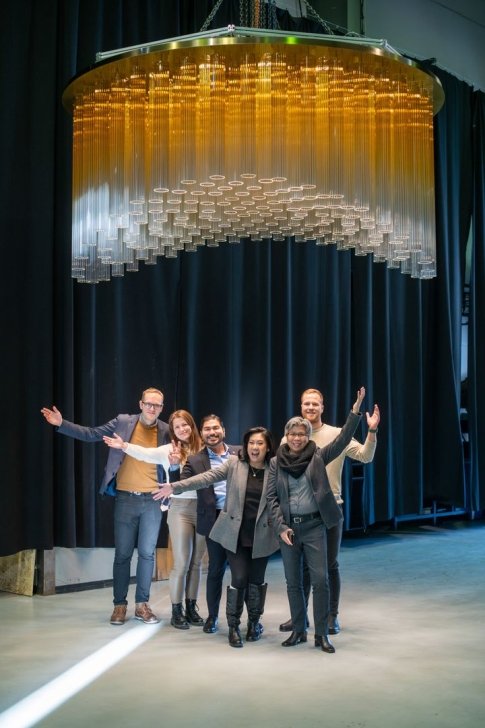 Client under a chandelier