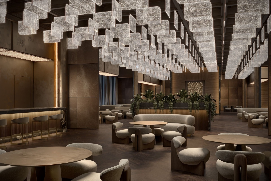 Elegant interior featuring modern lighting and comfortable seating at Downtown Design Dubai 2025.