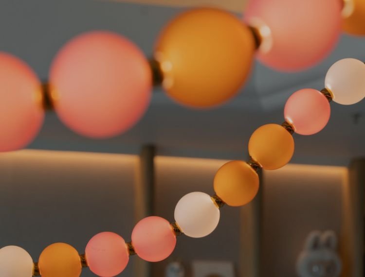 Colorful glass balls hanging in an interior, creating a cozy atmosphere.
