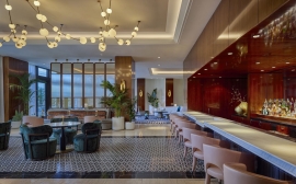 Luxurious bar interior featuring unique lighting and elegant seating.